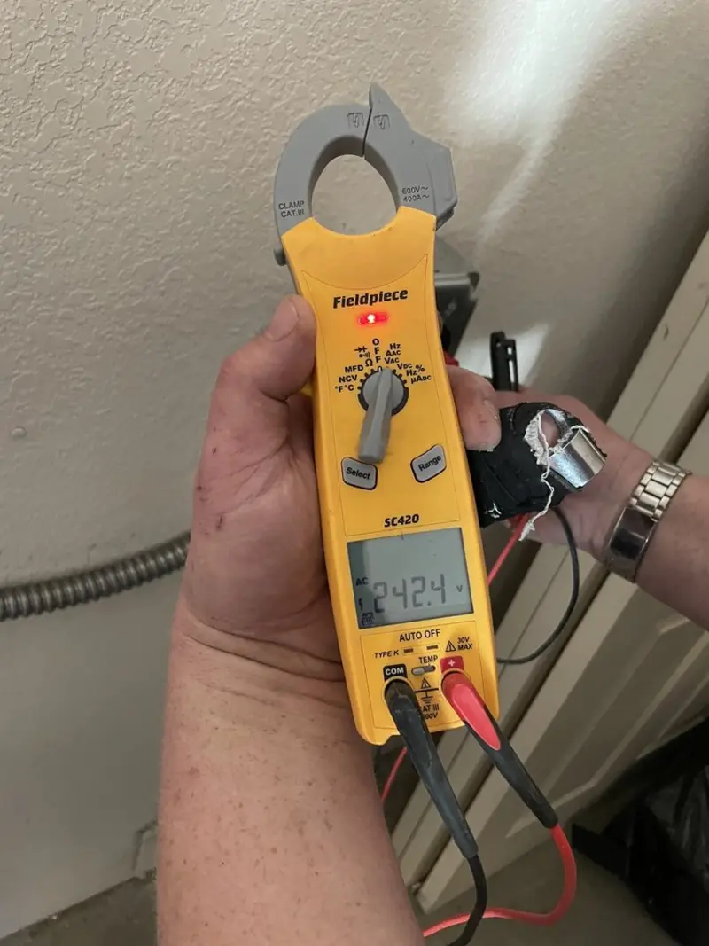 Voltage testing with clamp meter during Circuit Breaker Repair in Elmsford